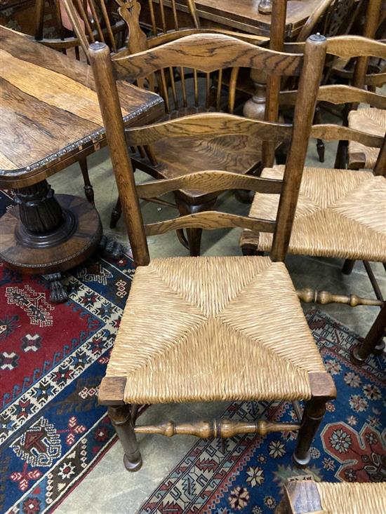 A late 19th / early 20th century set of six ash rush seated ladderback dining chairs